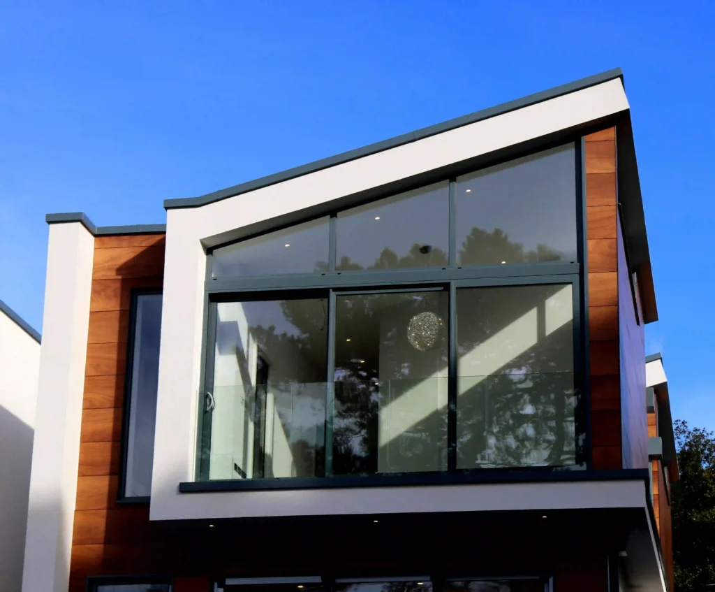 Modern house featuring a sleek glass exterior with contemporary architectural design, built by Manhattan Contracting, general contractors in NYC
